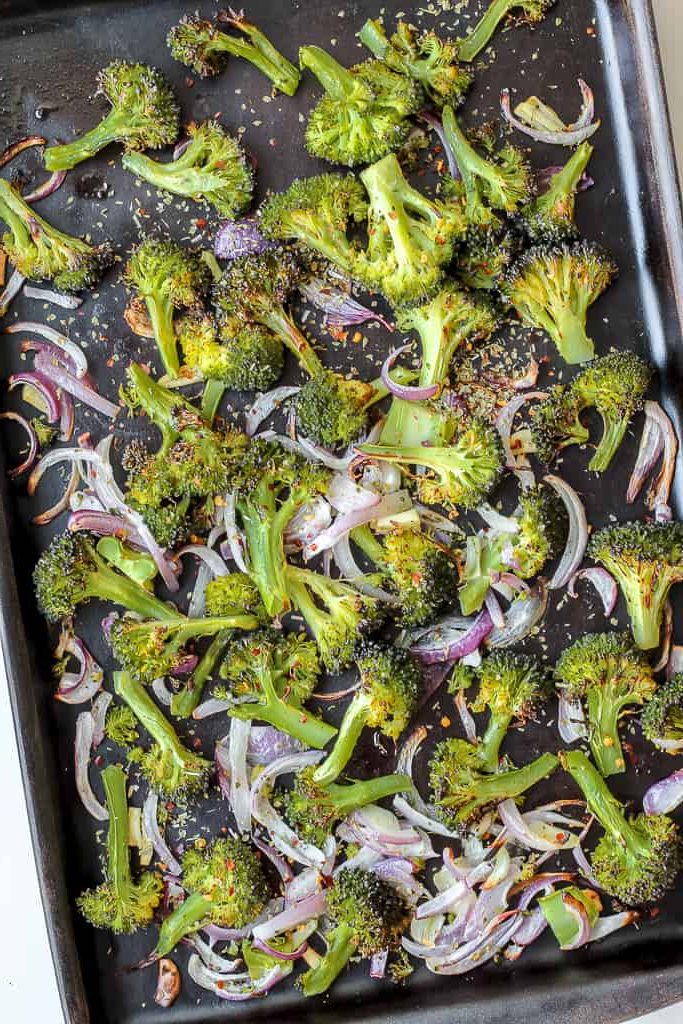 overhead shot of the roasted broccoli on a baking sheet 