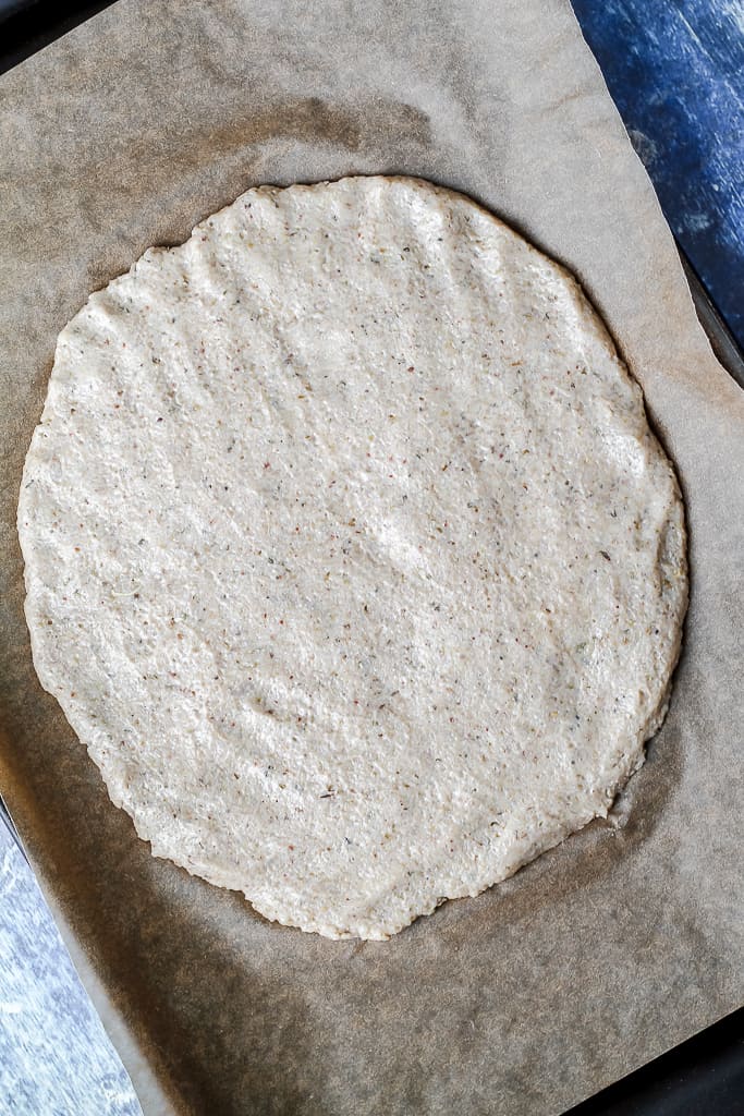 an overhead shot of the pizza crust before going into the oven 