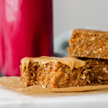 close up of a carrot cake oatmeal bar with a bite taken out of it