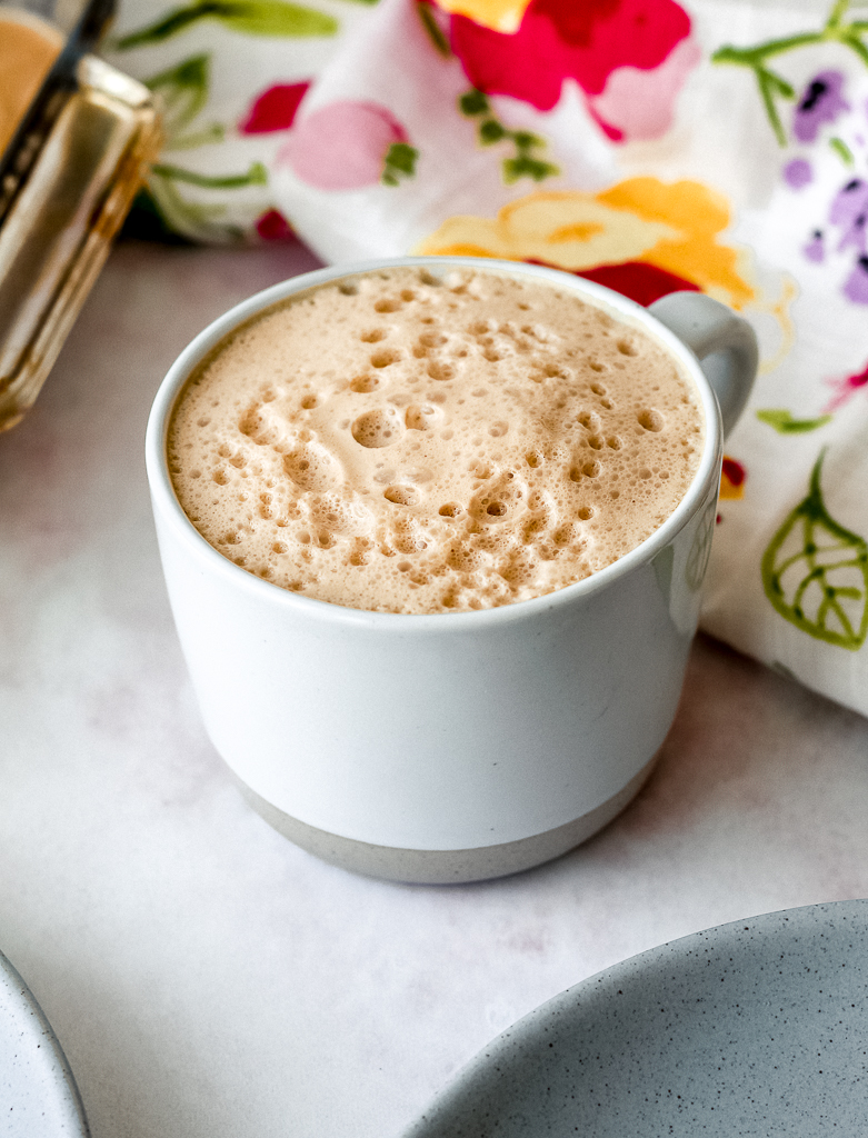 straight on shot of the white chocolate snickerdoodle latte in a mug 