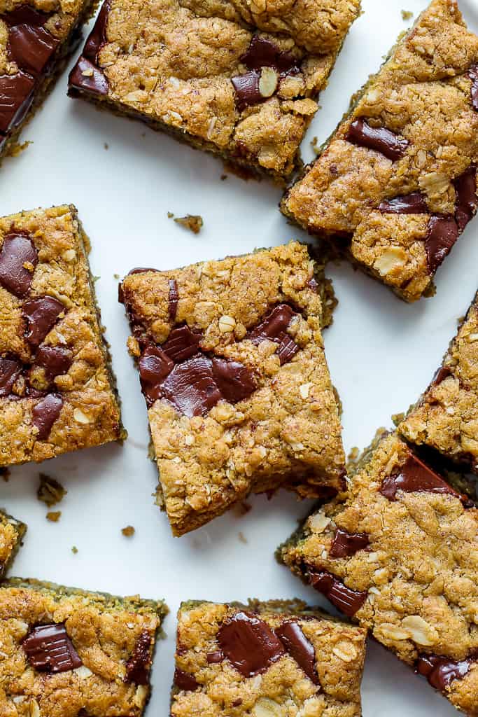 a close up overhead shot of the vegan chocolate chunk cookie bars on a white plate