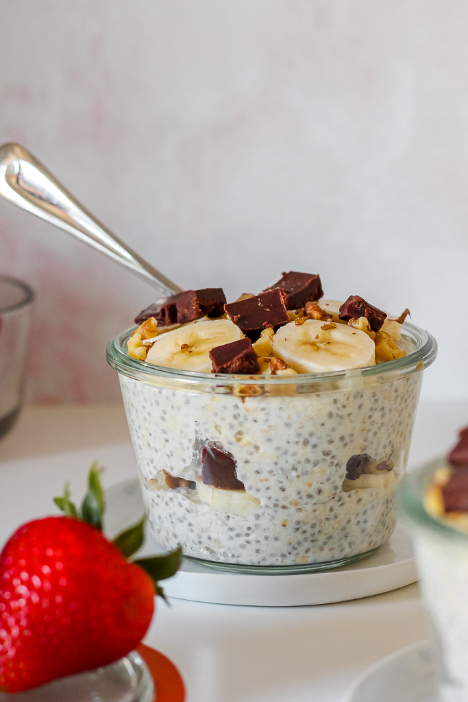 straight on shot of a bowl of the chunky monkey oats with a strawberry in the foreground 