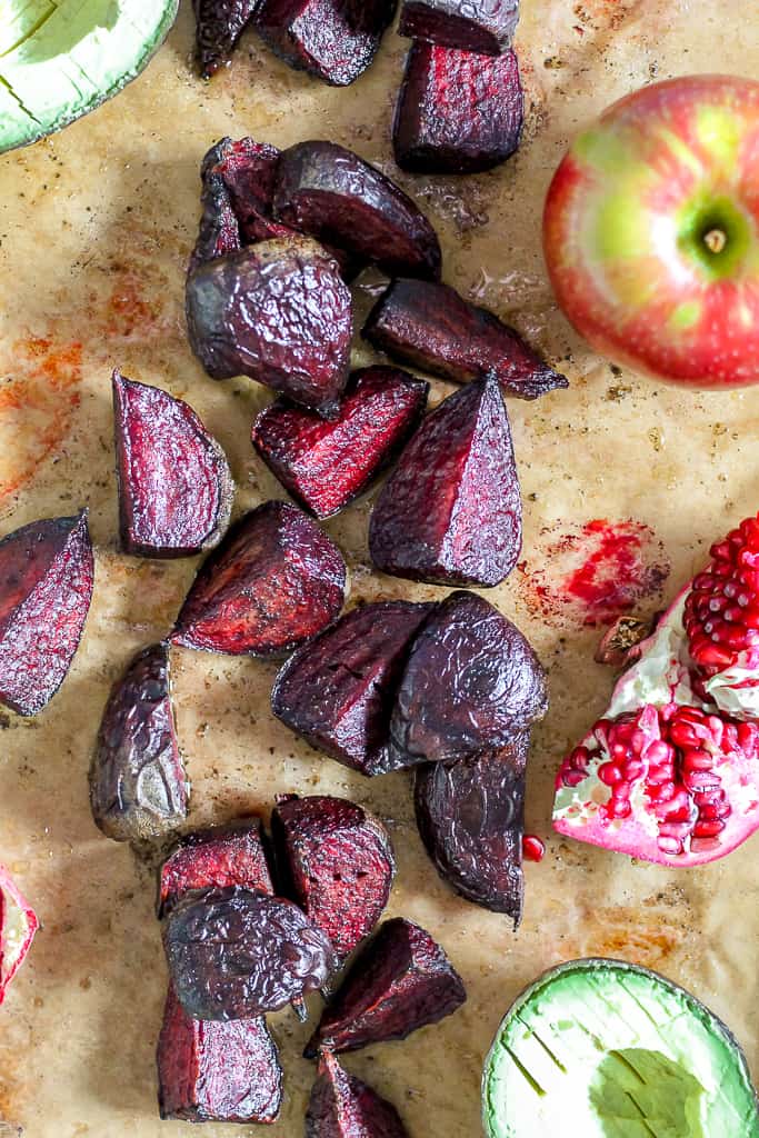 overhead shot of the roasted beets on a sheet of parchment paper