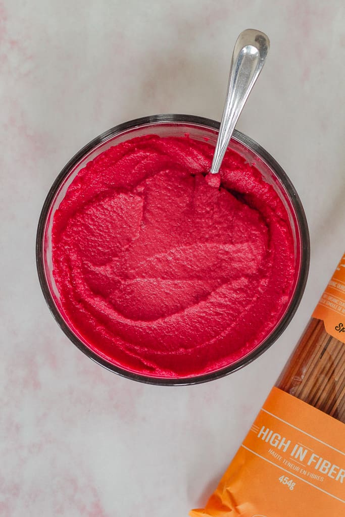 overhead shot of the beet hummus in a container