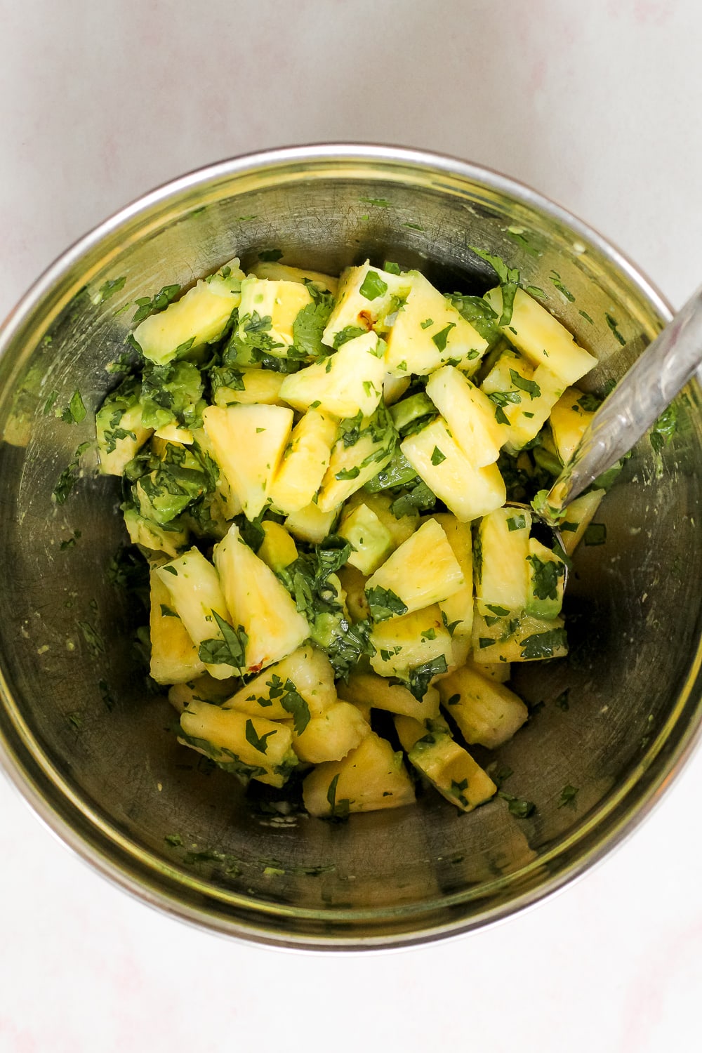 process shot of the making of the pineapple avocado salsa