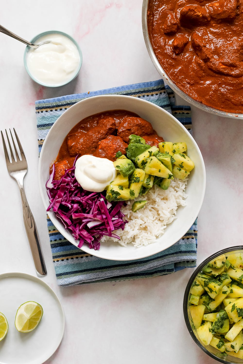 high angle overhead shot of the bowl of mole chicken rice, and pineapple avocado salsa