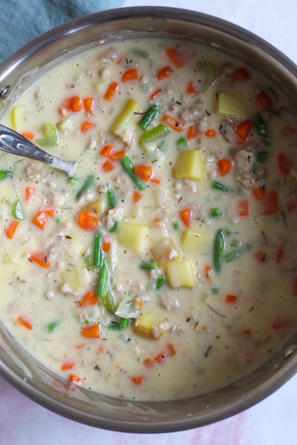 overhead shot showing the chicken sausage pot pie filling in a large pot