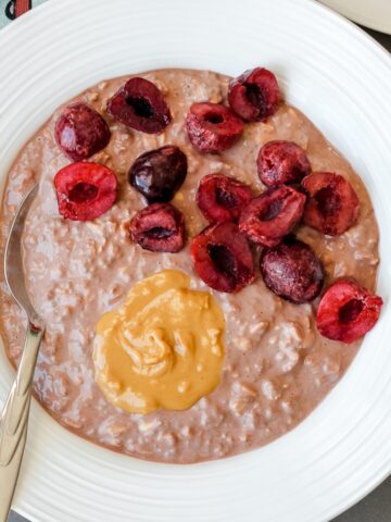 1200x1200 pixel featured image of chocolate overnight oats in a white bowl