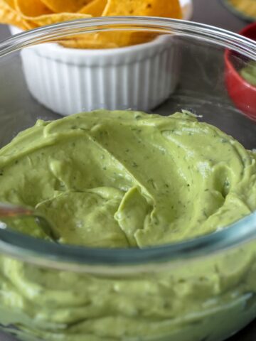 featured image for post, close up photo of the avocado crema in a glass container