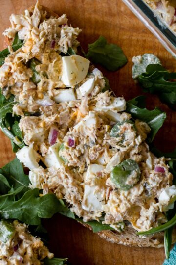 featured image, overhead photo of an open faced sandwich with tuna and egg