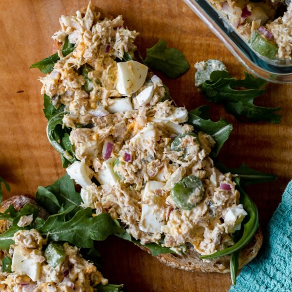 featured image, overhead photo of an open faced sandwich with tuna and egg