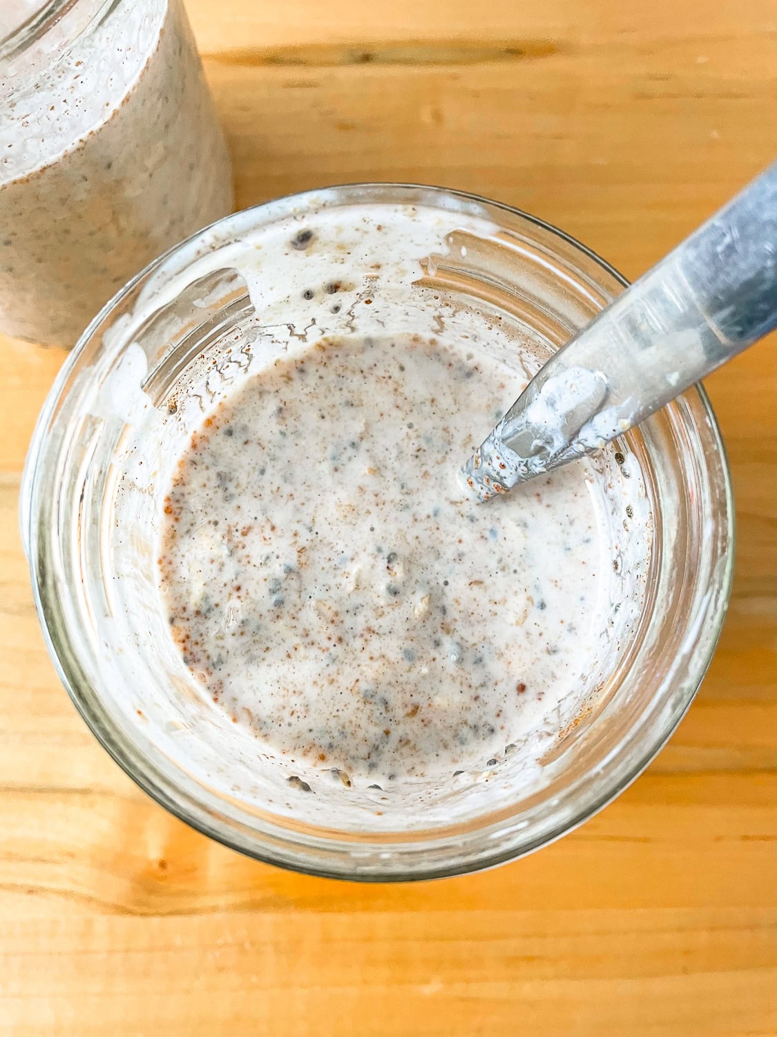 process photo of the oats mixed up in a jar
