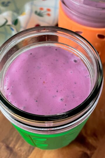featured image for the post, a photo of two colourful glasses with the smoothie in them