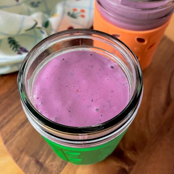 featured image for the post, a photo of two colourful glasses with the smoothie in them