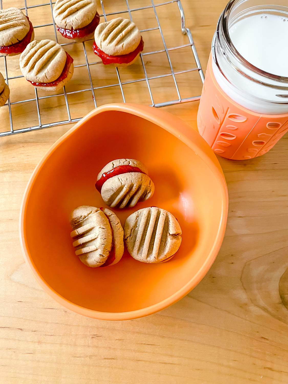 overhead photo of three of the sandwich cookies in a bowl