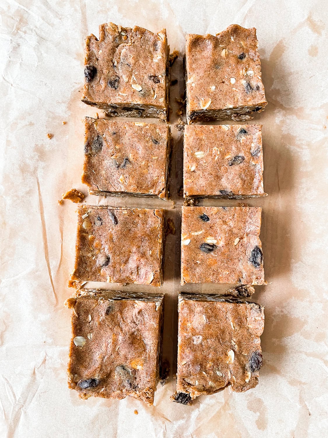 eight protein bars on a sheet of parchment paper 